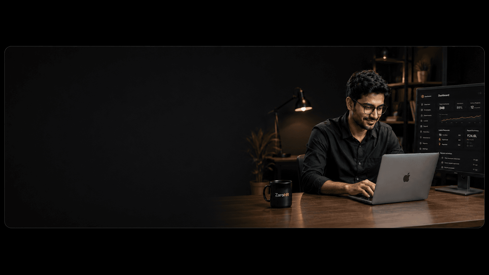 HR professional working in the ZaroHR HRMS on a laptop